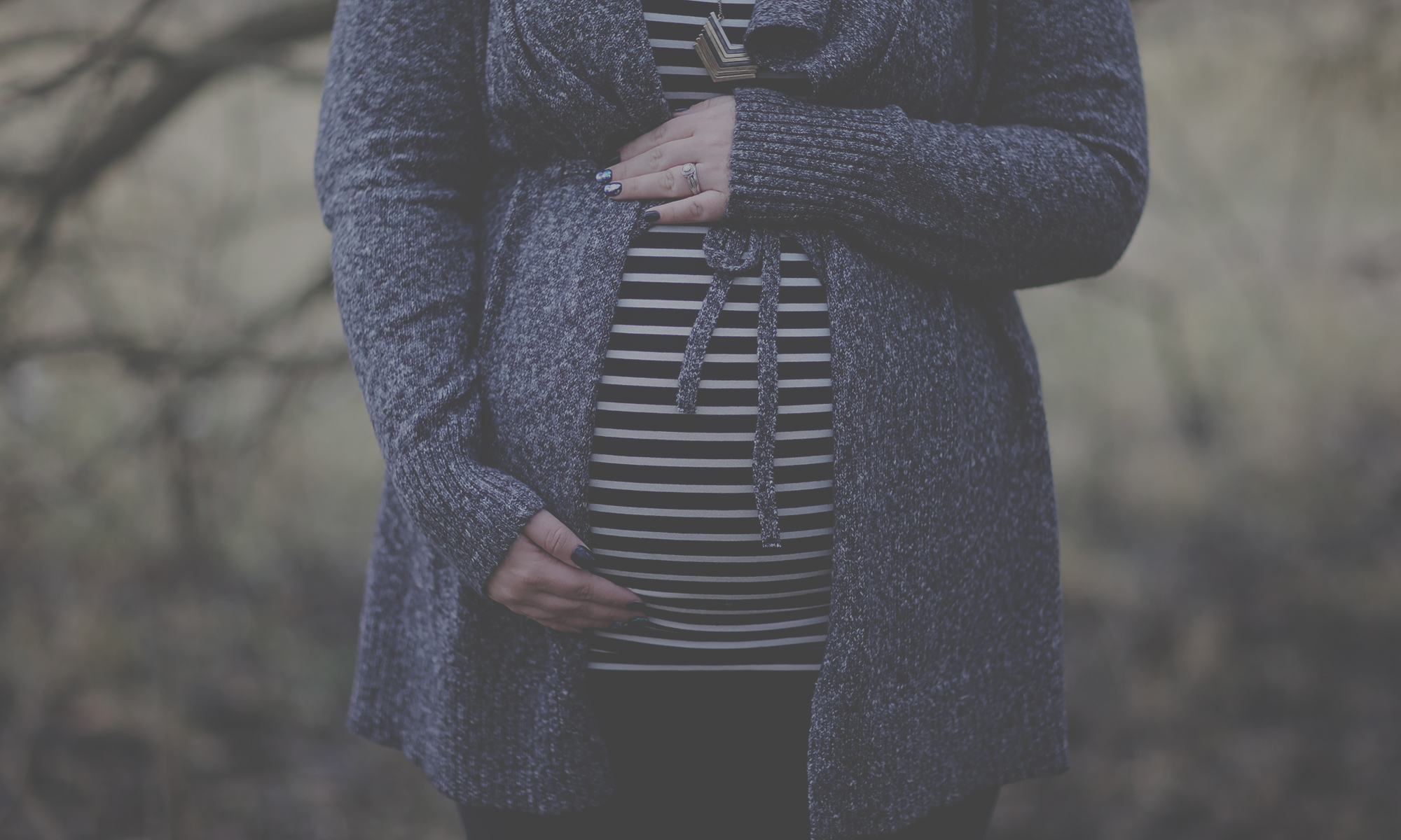 pregnant woman with sweater on